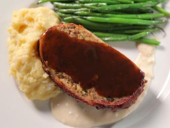 Jo's Bacon-Wrapped Meatloaf as Served at Jo's Diner in San Diego, California, as seen on Diners, Drive-Ins and Dives, Season 30.